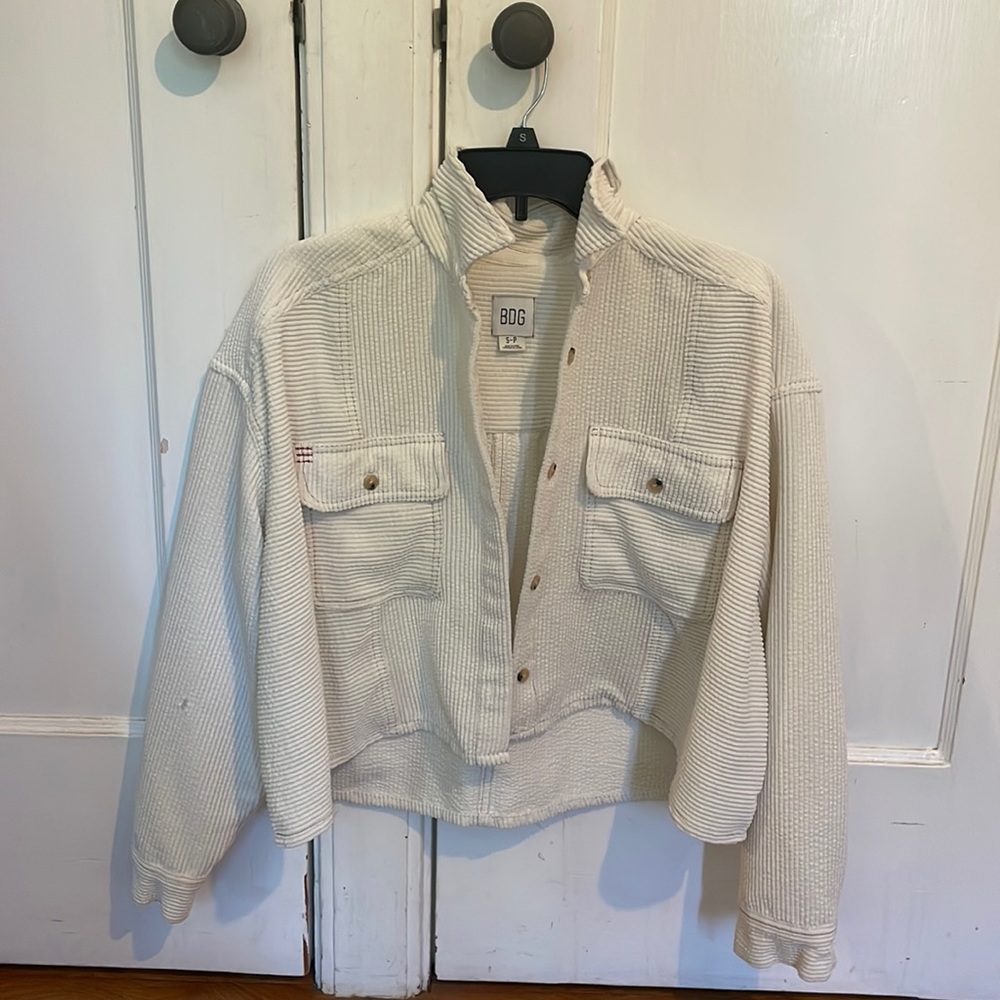 White long sleeve cropped and button up sweater.
